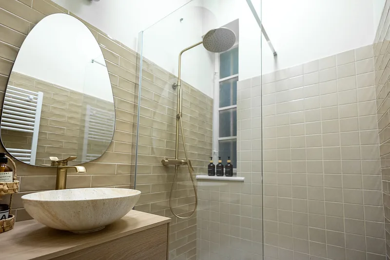 Shower room with stone tiles in a wellness area